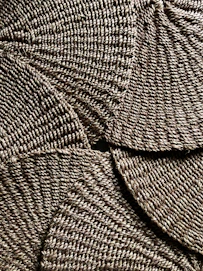brown and white woven textile