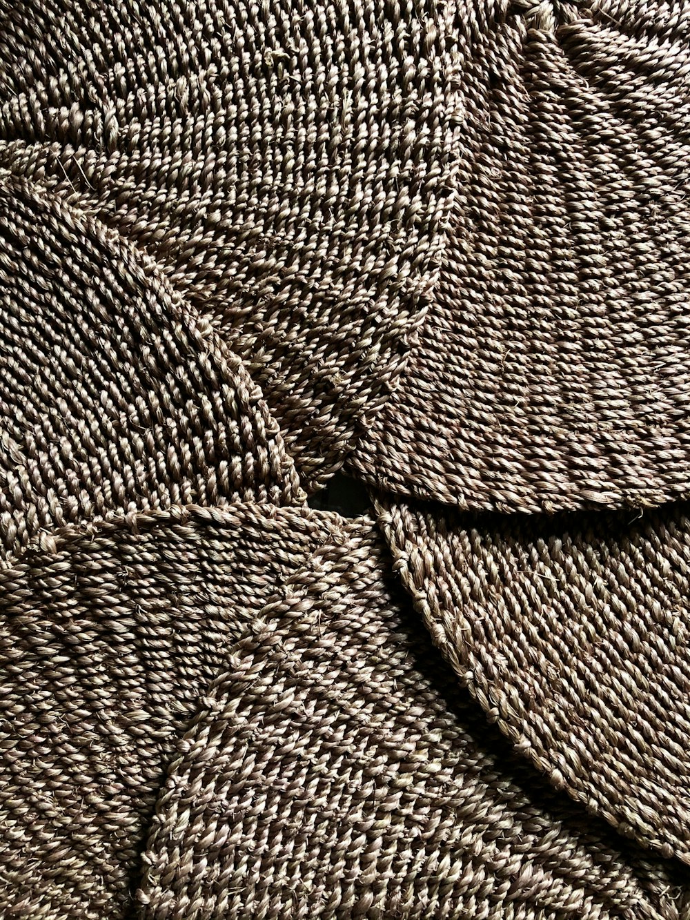brown and white woven textile