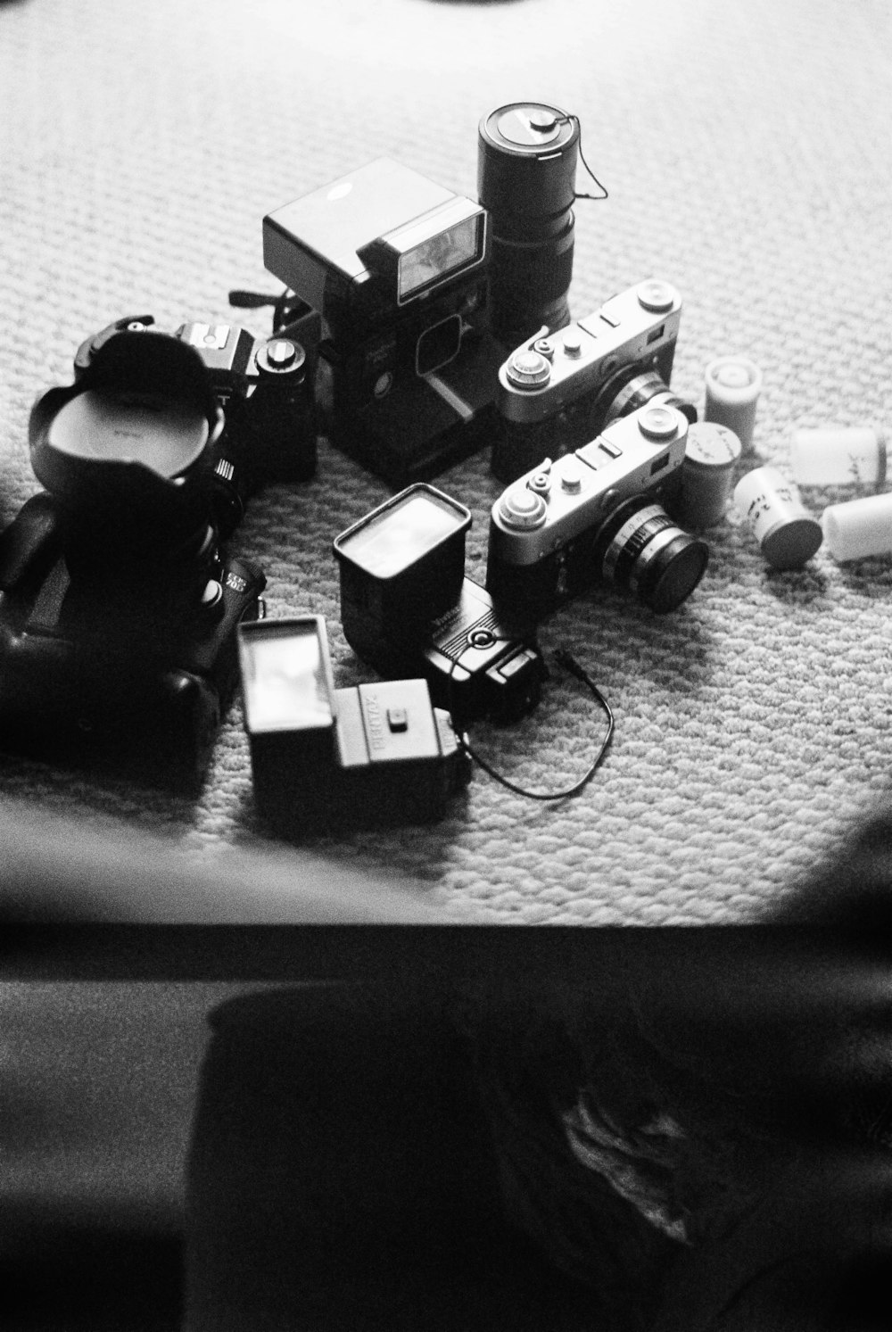 grayscale photo of camera on table