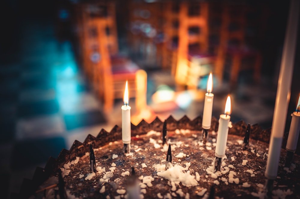 white candles on black cake