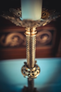 A close-up of a beautifully crafted candle with intricate designs.