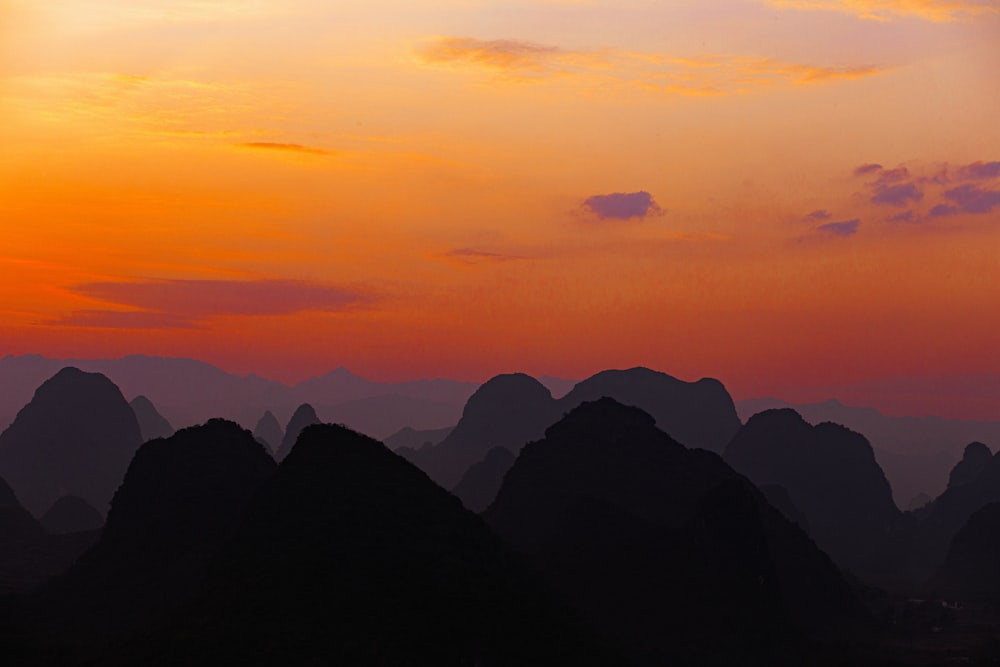 silhouette of mountains during sunset