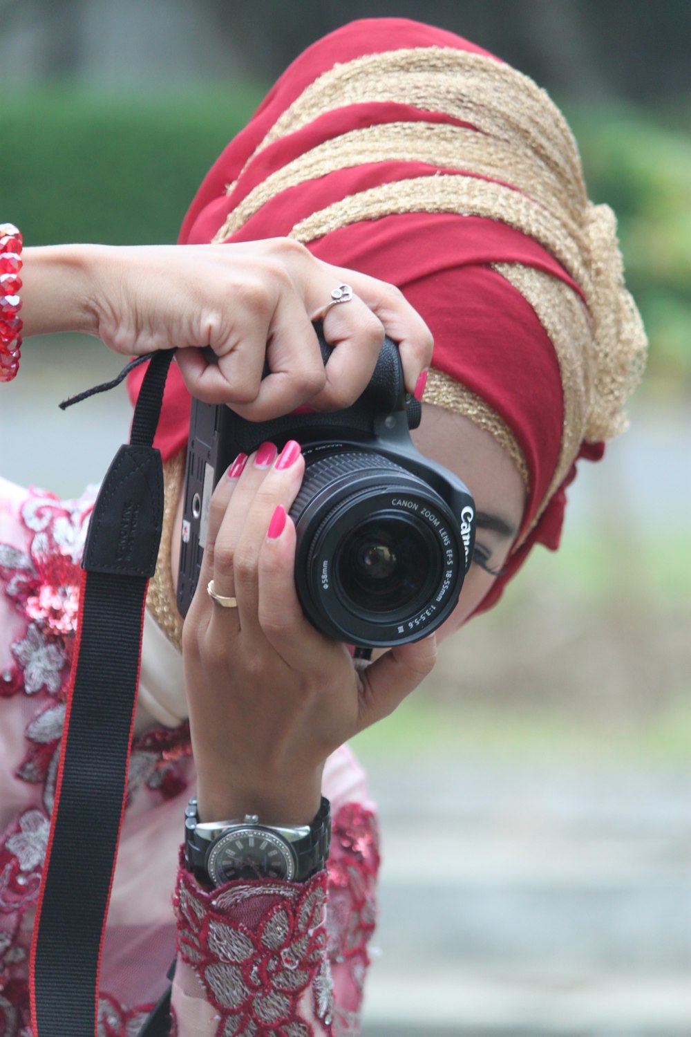 person holding black nikon dslr camera