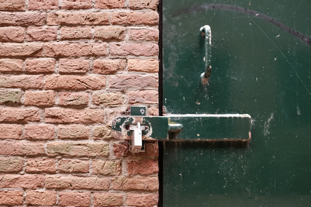 green wooden door with padlock