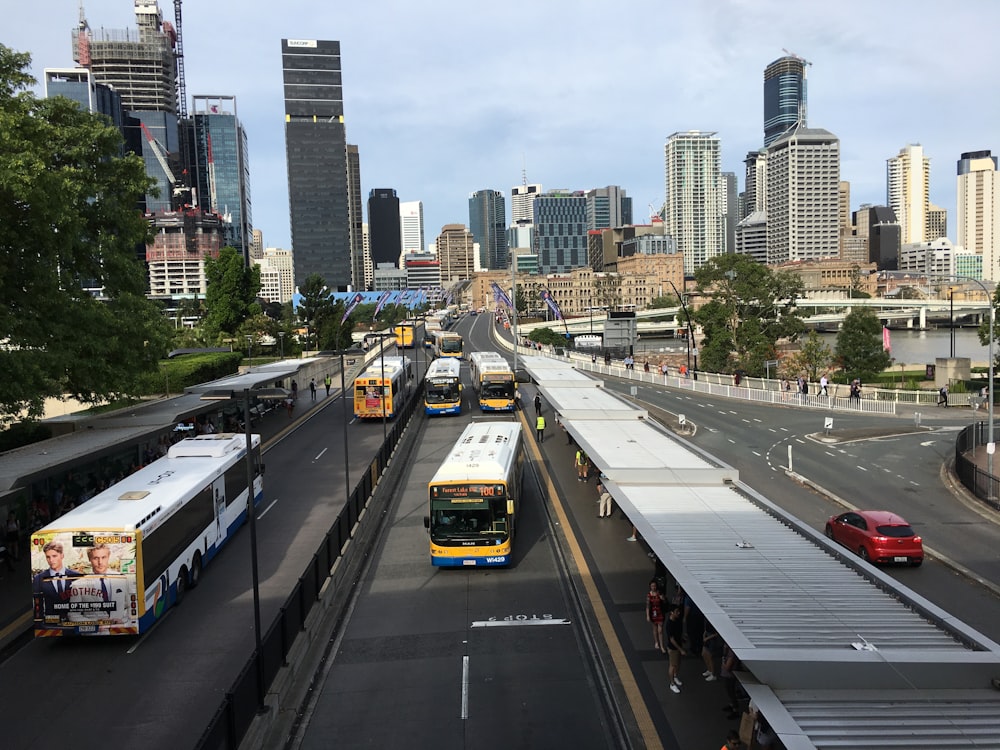 yellow and black bus on road during daytime