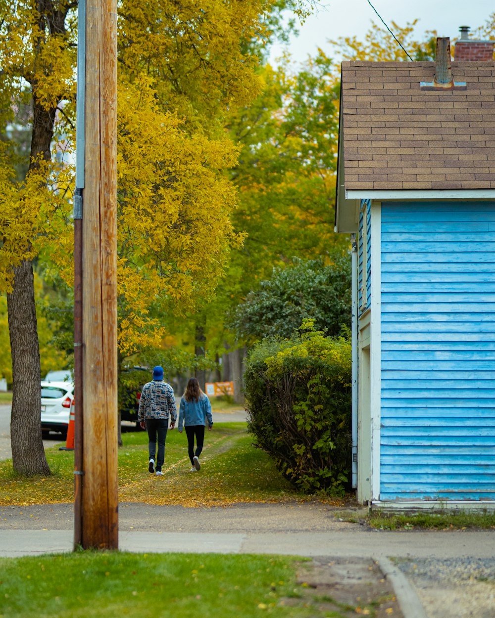 2 person walking on sidewalk during daytime