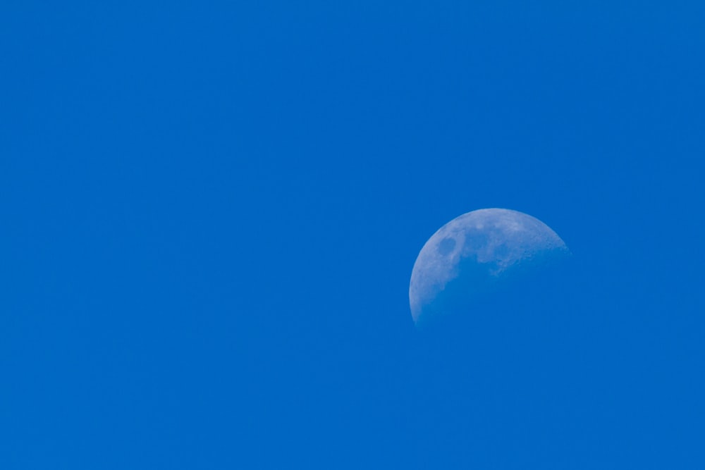 blue sky with white moon
