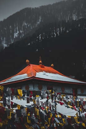 Tibetian Monastery in Manali with snowy Himalayan mountains in backdrop