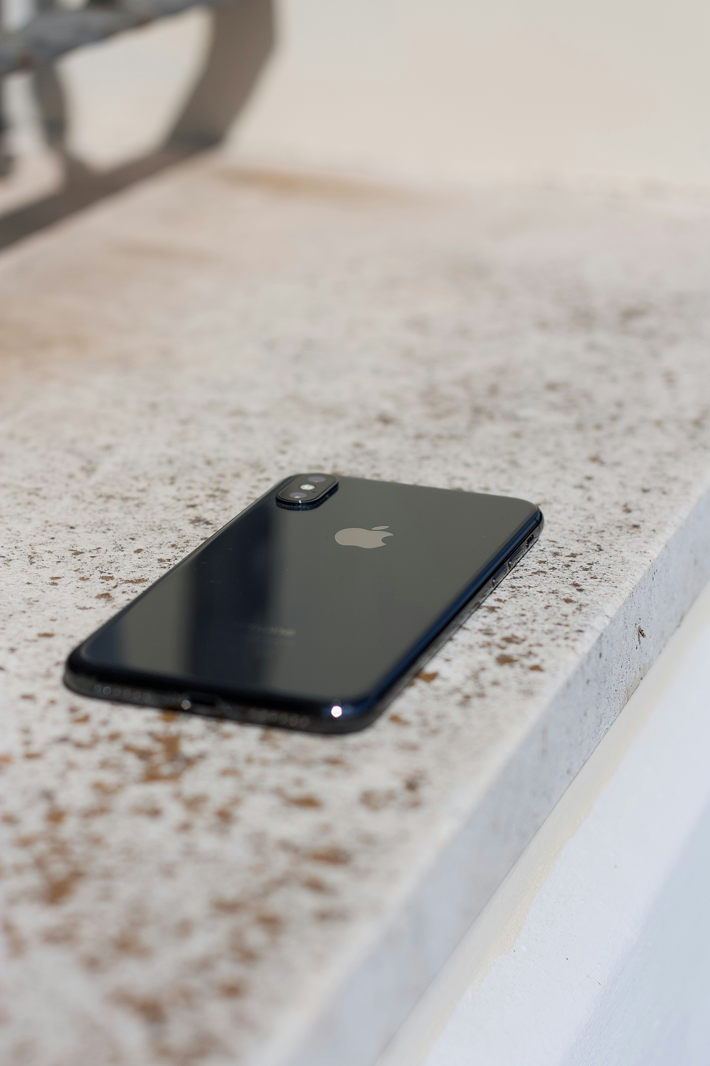 black iphone 7 on white table