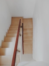 Close-up of a clean, well-lit stairwell in a residential building.