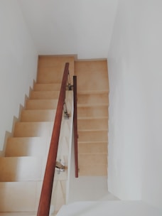 Close-up of a clean, well-lit stairwell in a residential building.