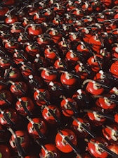 red and black ceramic mugs on black steel rack