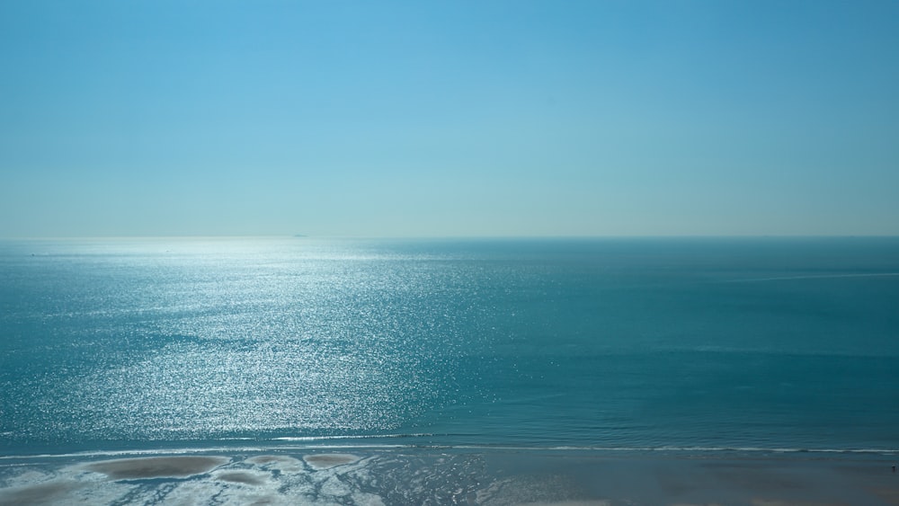 blue sea under blue sky during daytime