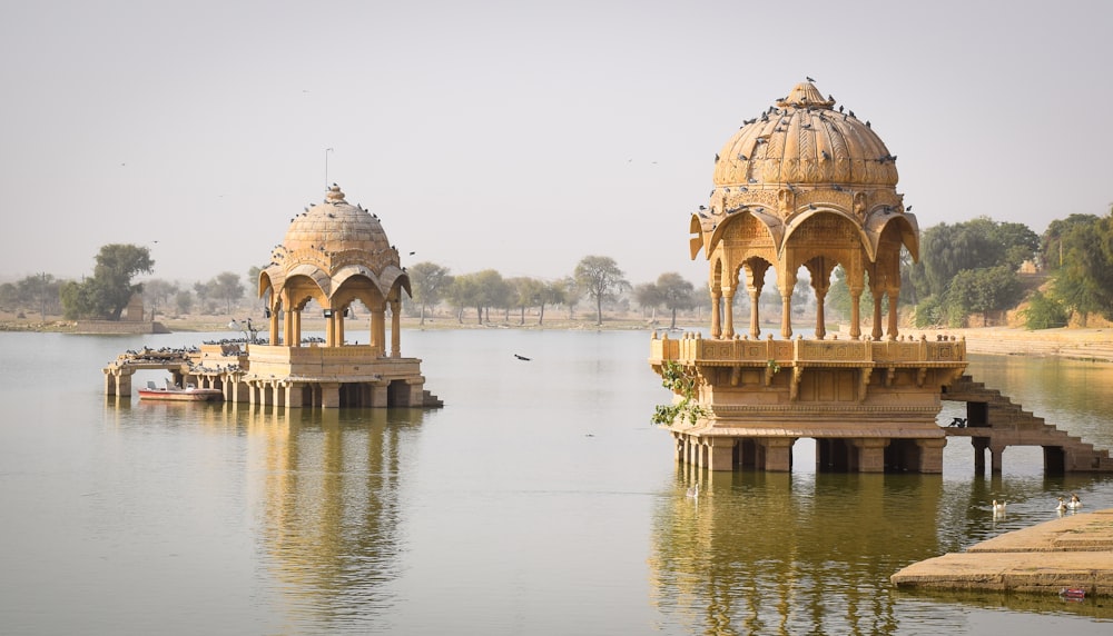 brown concrete building near body of water during daytime