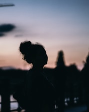 silhouette of woman during sunset