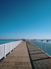 people walking on wooden dock during daytime