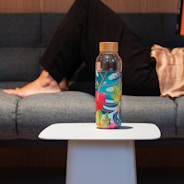 clear glass bottle on white table
