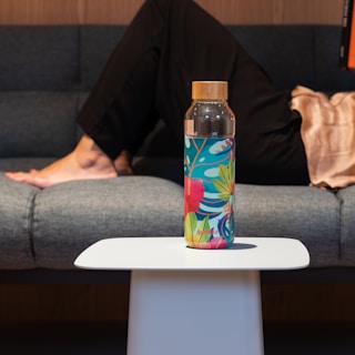 clear glass bottle on white table