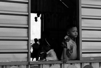 The Geographic Traveller: The Cambodian River That Becomes a Lake boy in floating village tonle sap
