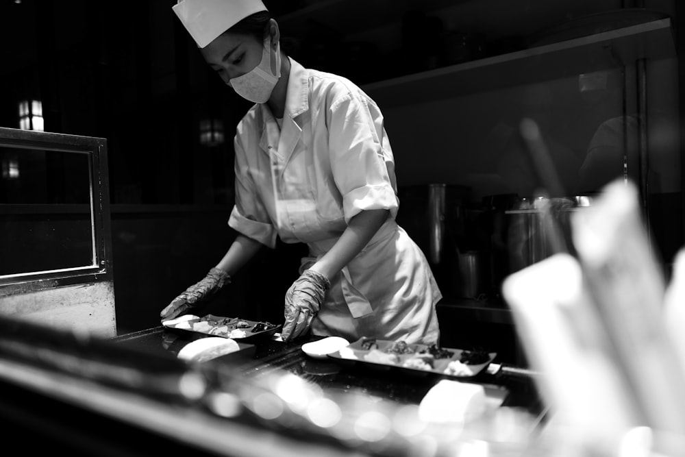 man in white chef uniform holding knife