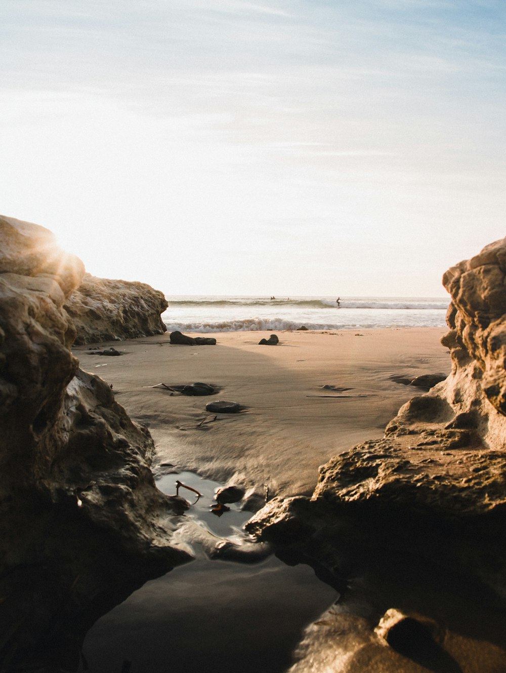 brown rock formation on sea shore during daytime