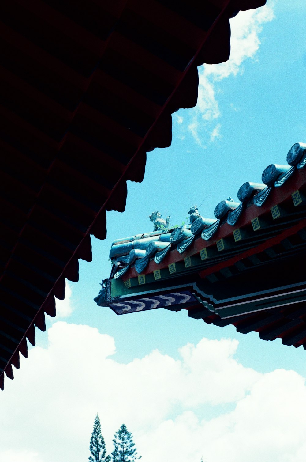 brown roof under white clouds during daytime