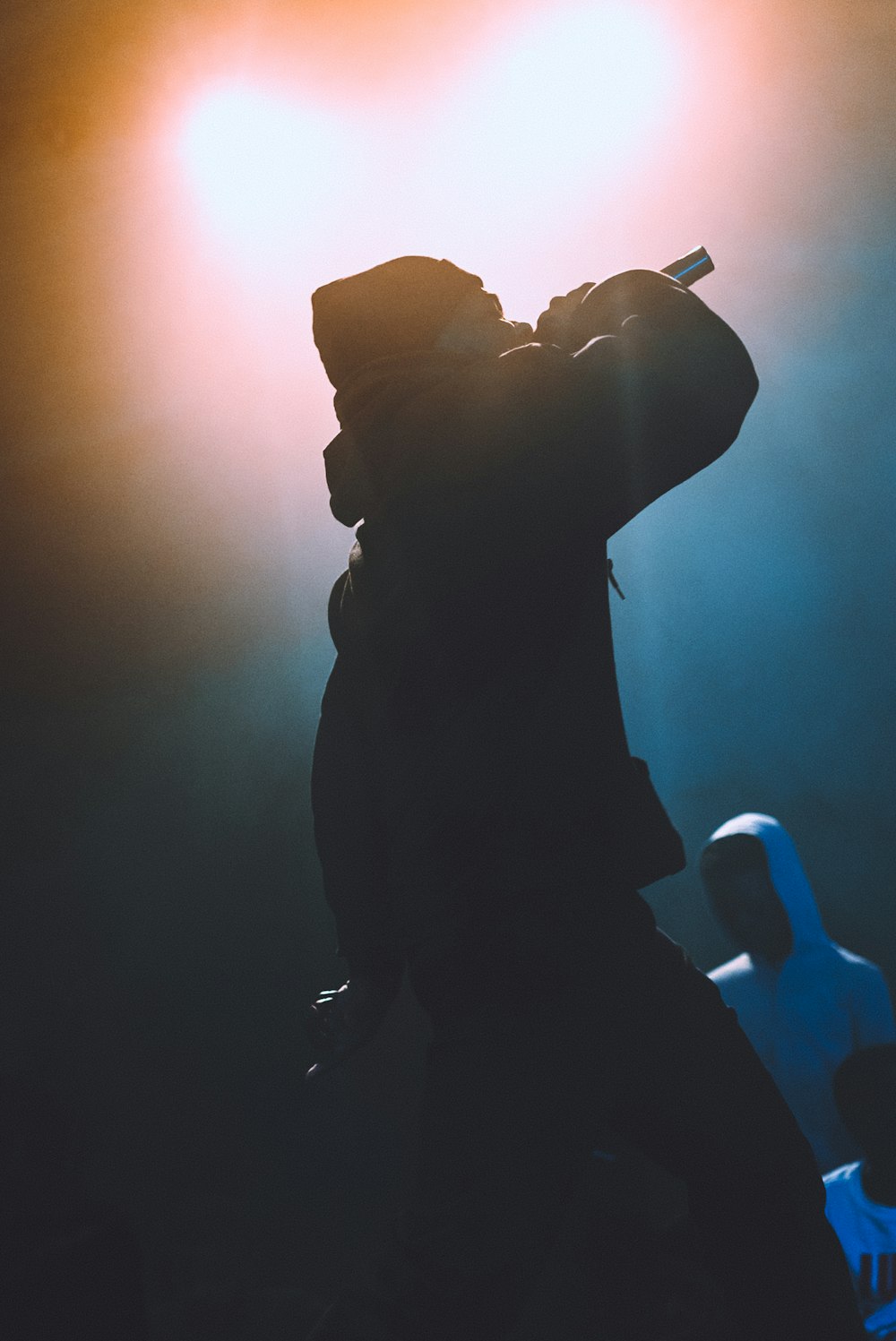 silhouette of man holding camera