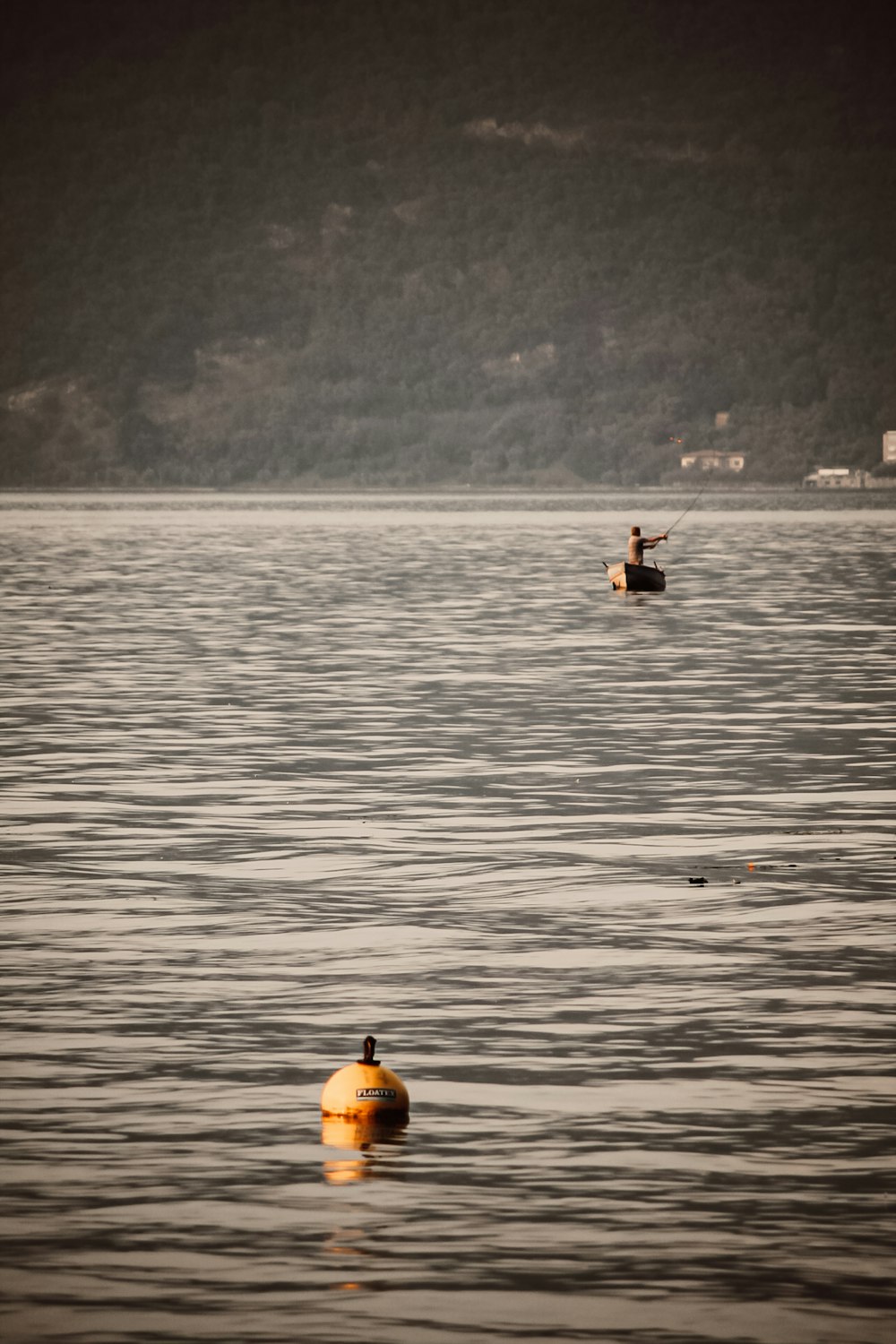 2 people riding on boat on sea during daytime