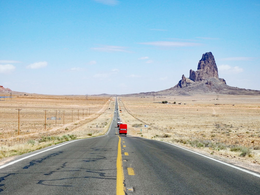 red car on road during daytime