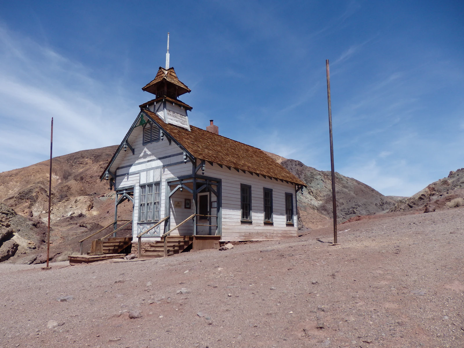 Former schoolhouse at Calico Ghost Town near Barstow, California, under a blue desert sky