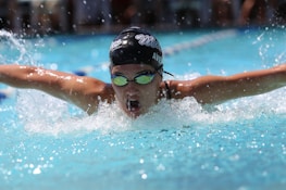 person in swimming goggles in swimming pool