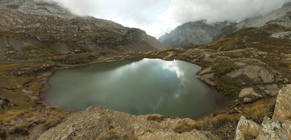 lake in the middle of mountains