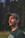 man in black crew neck shirt wearing black hat