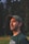 man in black crew neck shirt wearing black hat