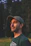 man in black crew neck shirt wearing black hat