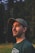 man in black crew neck shirt wearing black hat