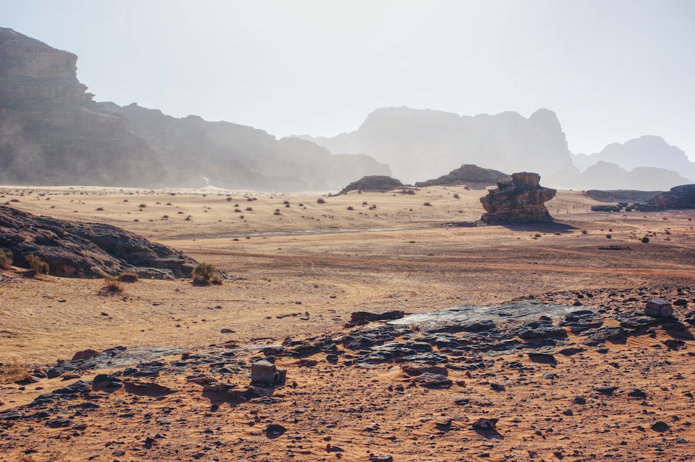 brown sand and brown mountains during daytime