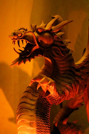 A detailed 3D-rendered dragon wrapped around a glowing orb, showcasing intricate textures and shadows.