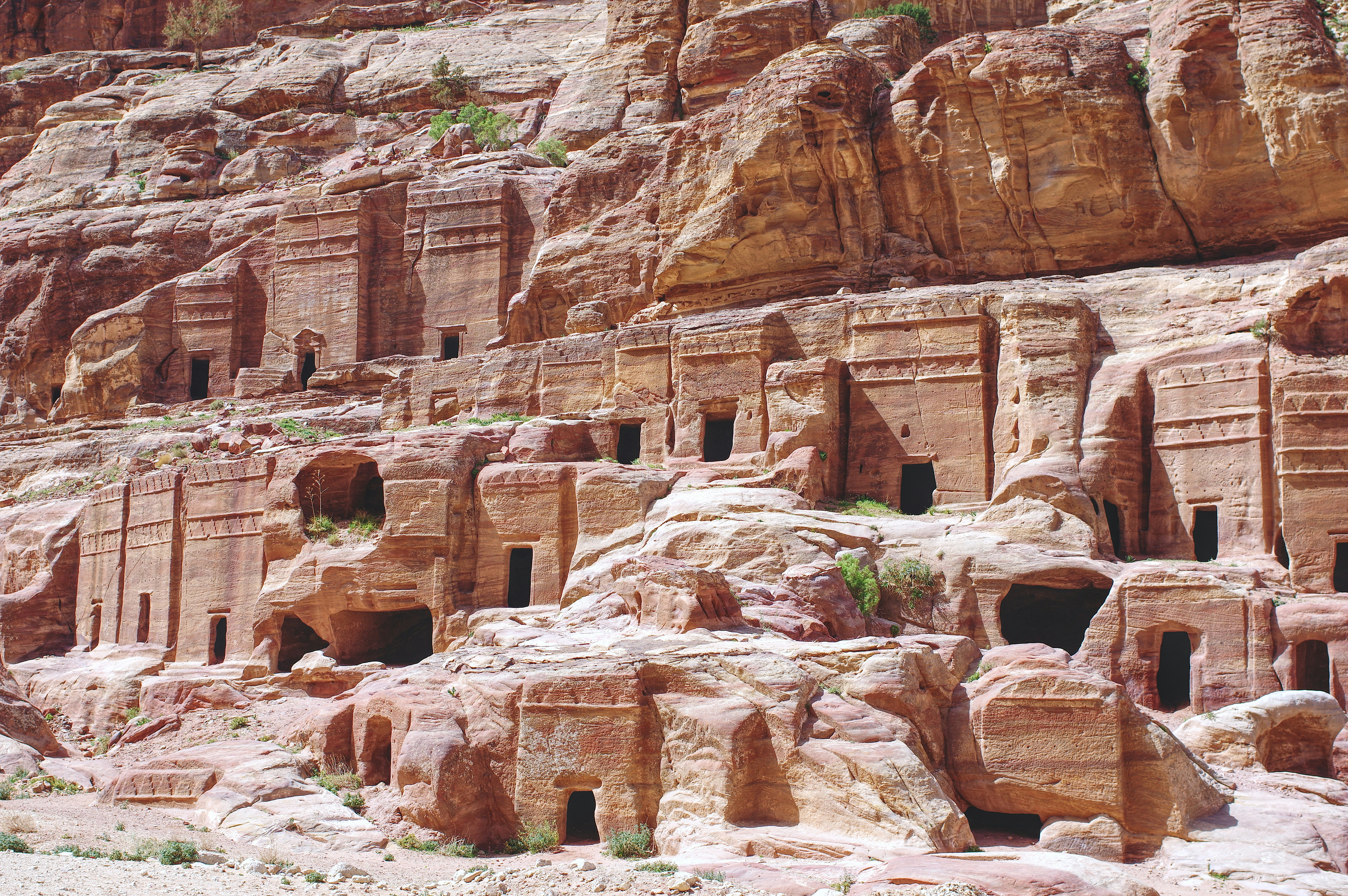 brown rock formation during daytime, Graves in the rock