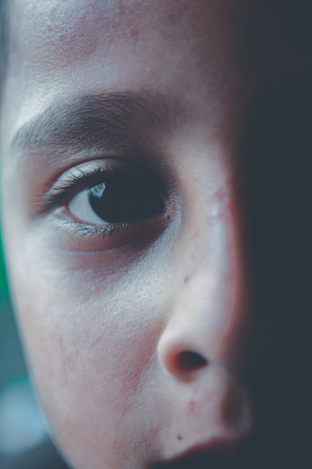 a close up of a person's face with a blurry background