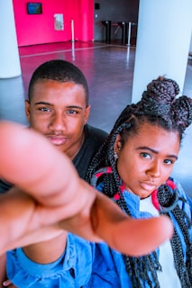 A dynamic shot of a brand representative and influencer shaking hands in a modern office.