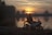 A scenic sunset view over a lake with a rider enjoying the tranquility.