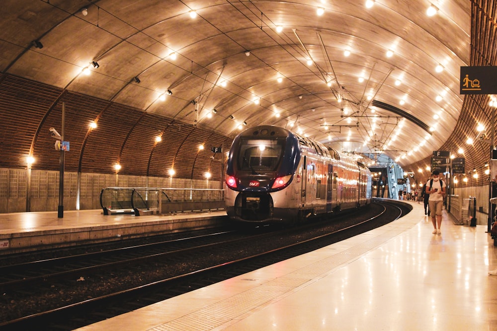 black and red train on train station