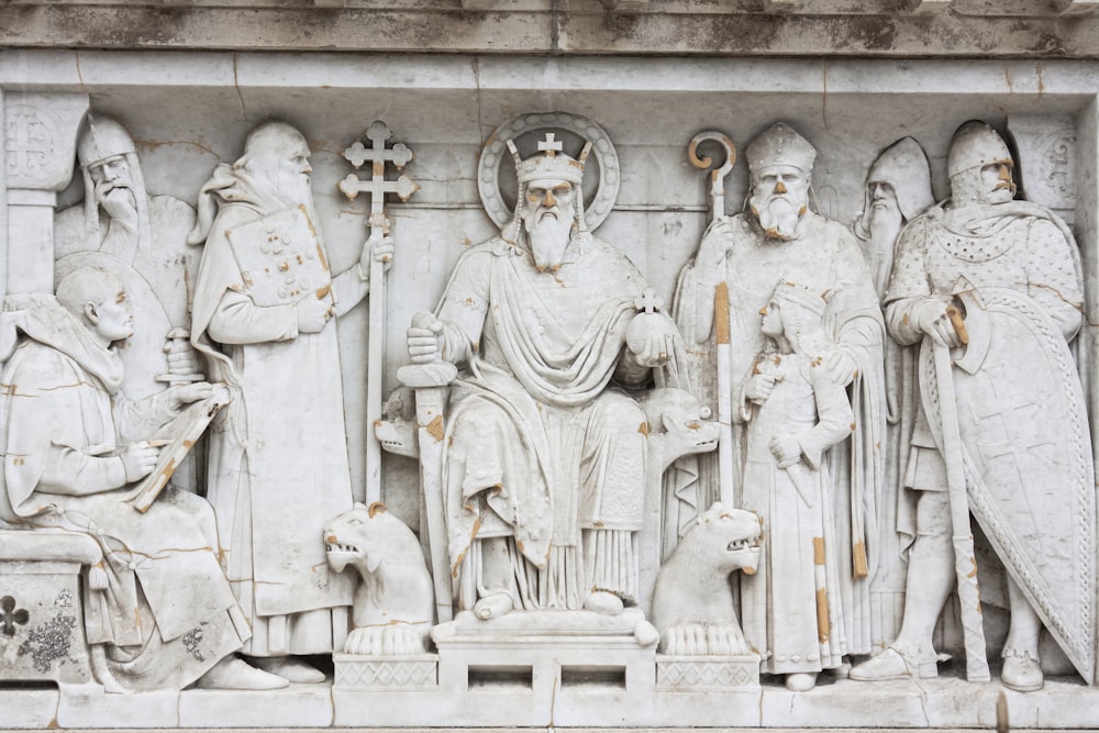 grayscale photo of man and woman statue