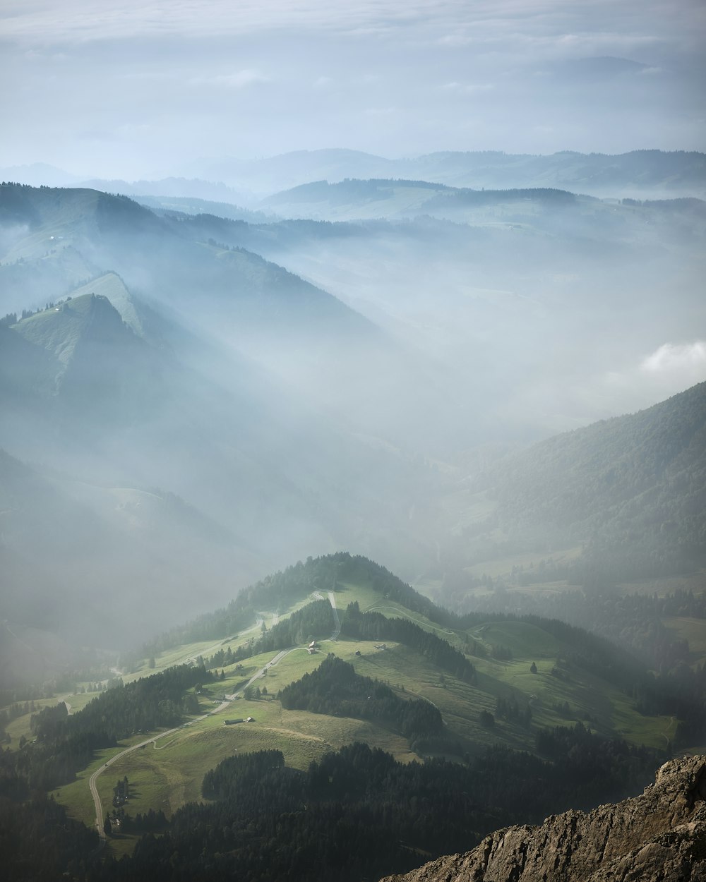 green mountains under white clouds during daytime