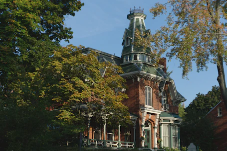 A beautifully restored family home bathed in golden sunlight, symbolizing hope and new beginnings.