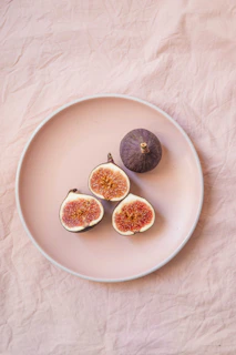 sliced apple on white ceramic bowl