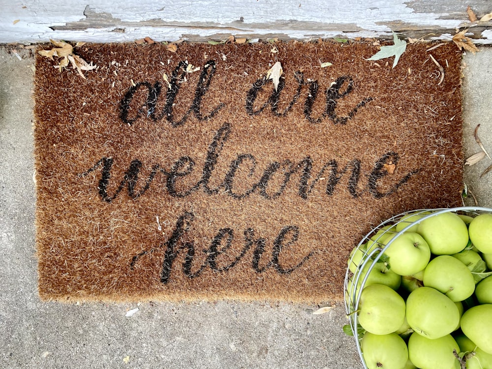 brown and black welcome rug