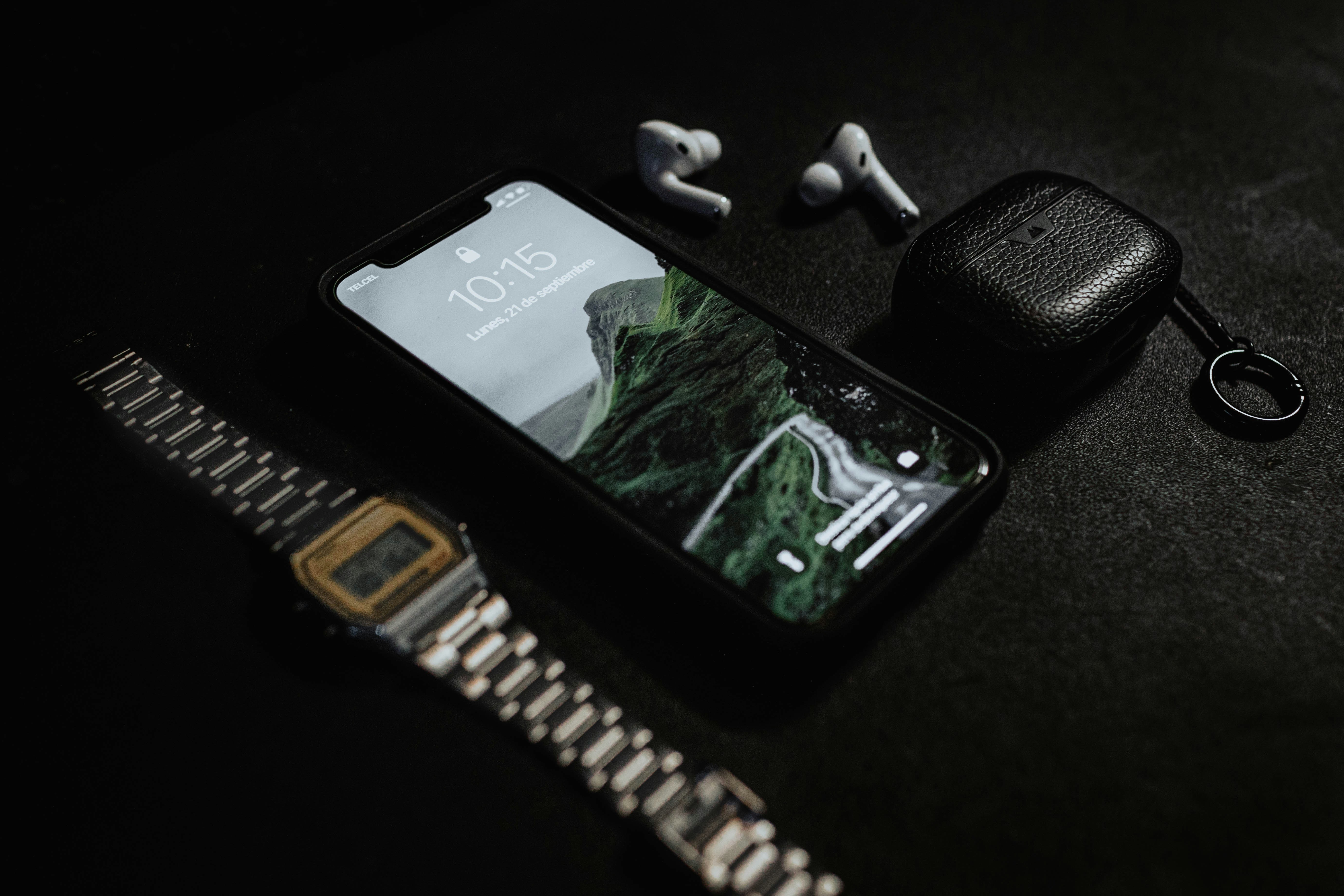 Black iPhone 4 on black surface