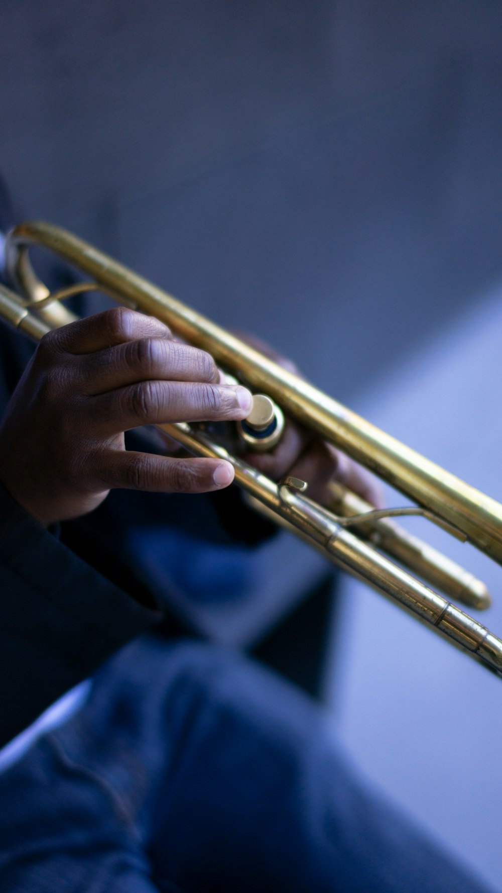 gold trumpet on blue textile